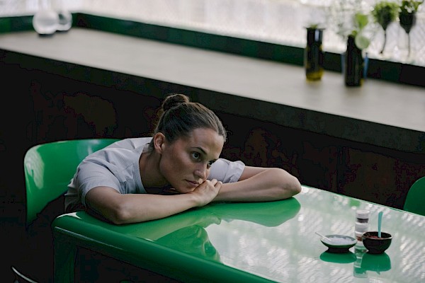 Alicia Vikander in THE ASSESSMENT, a Magnolia Pictures release. Photo credit: Jörn Neumann. © 2024 Number 9 Films Assessment Limited, TA Co-Production GmbH, ShivHans Productions, LLC, TA2022 Investors, LLC, Tiki Tāne Pictures, LLC. Photo courtesy of Magnolia Pictures.