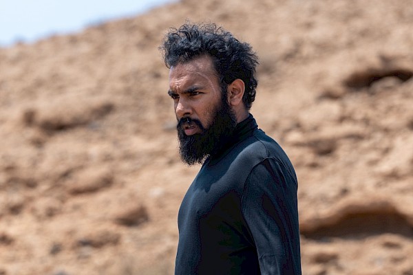 Himesh Patel in THE ASSESSMENT, a Magnolia Pictures release. Photo credit: Cristina Rios. © 2024 Number 9 Films Assessment Limited, TA Co-Production GmbH, ShivHans Productions, LLC, TA2022 Investors, LLC, Tiki Tāne Pictures, LLC. Photo courtesy of Magnolia Pictures.